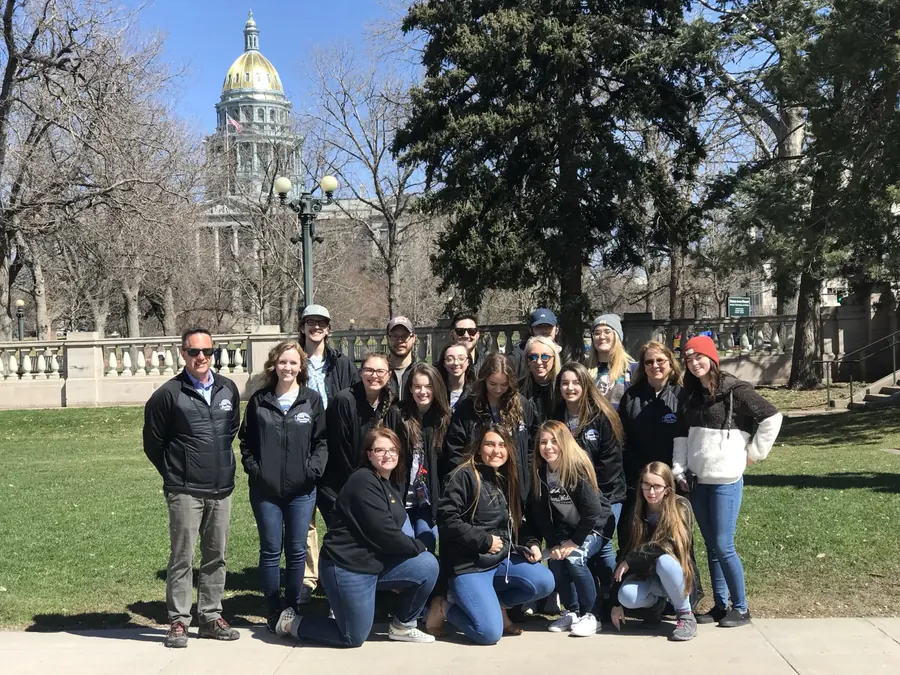 Zac Northup with students in front of the Colorado State Capitol in Denver.