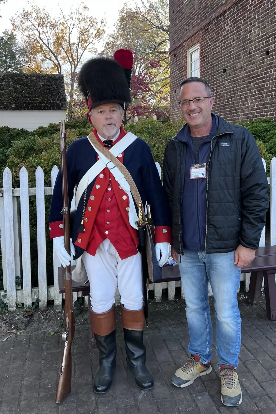 Zac Northup standing beside a reenactor in a Continental Army uniform.